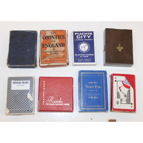 632 - A large qty of assorted vintage playing cards and playing card related games