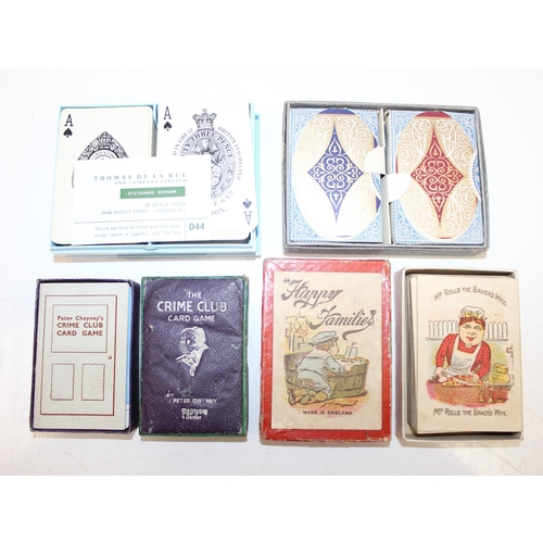 632 - A large qty of assorted vintage playing cards and playing card related games