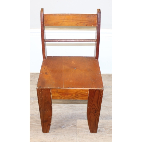 99 - A vintage wooden children's roll top desk by Swallow and a similar small chair, the desk approx 56cm... 