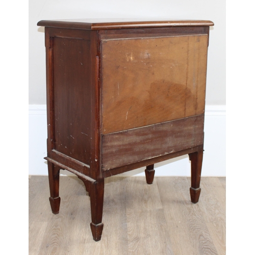 102 - A small antique mahogany side cabinet with 2 doors, standing on spade legs, the interior with single... 