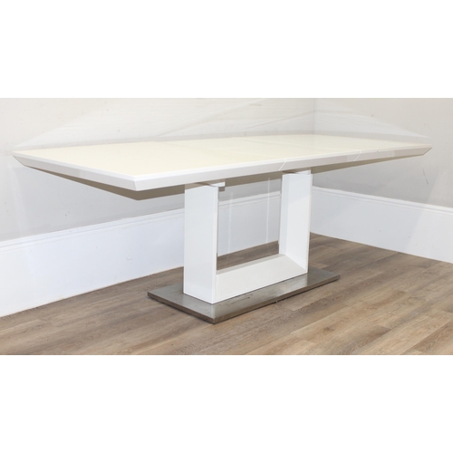 21 - A large modern white extending dining table with brushed steel base, seemingly unmarked, approx 160c... 