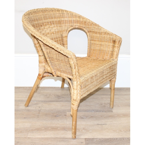 18 - A pair of wicker chairs and a large wicker laundry basket, each chair approx 60cm wide, the basket a... 