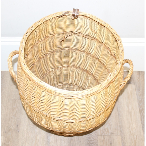 18 - A pair of wicker chairs and a large wicker laundry basket, each chair approx 60cm wide, the basket a... 