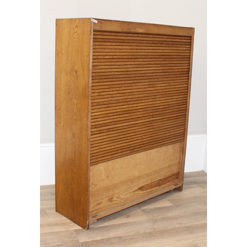 30 - A large vintage tambour fronted oak bookcase, early-mid 20th century, approx 100cm wide x 35cm deep ... 