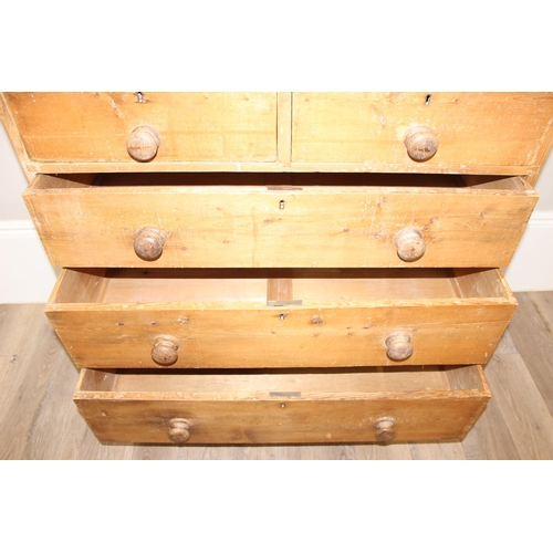 12 - A Victorian pine 2 over 3 chest of drawers with turned wooden handles and bun feet, approx 92cm wide... 