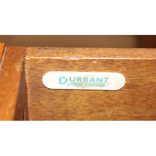 11 - A retro brown leather topped oak desk by Durant office furniture, approx 153cm wide x 76cm deep x 73... 