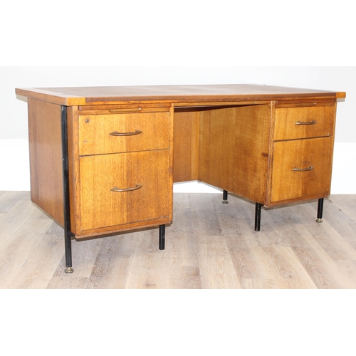 11 - A retro brown leather topped oak desk by Durant office furniture, approx 153cm wide x 76cm deep x 73... 