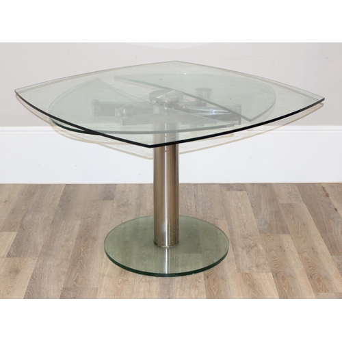 15 - A retro style extending glass table with chrome base and unusual mechanism, seemingly unmarked, appr... 