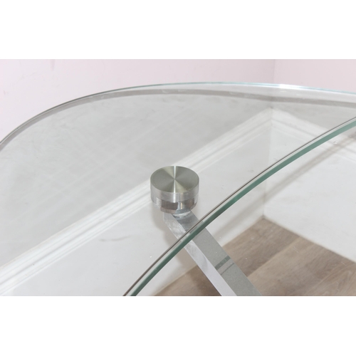 15 - A retro style extending glass table with chrome base and unusual mechanism, seemingly unmarked, appr... 