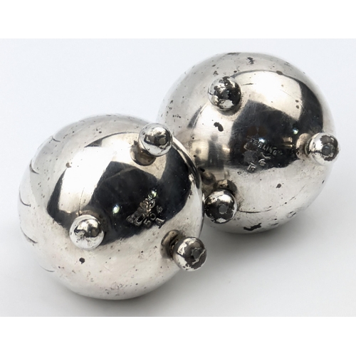 1088 - A pair of Sterling silver pepper pots, marked Sterling and XRF confirmed, likely American, one top a... 