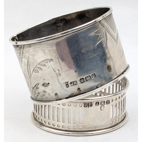 1108 - 4 assorted silver napkin rings and a Victorian silver pepper pot, various dates and makers, approx 5... 