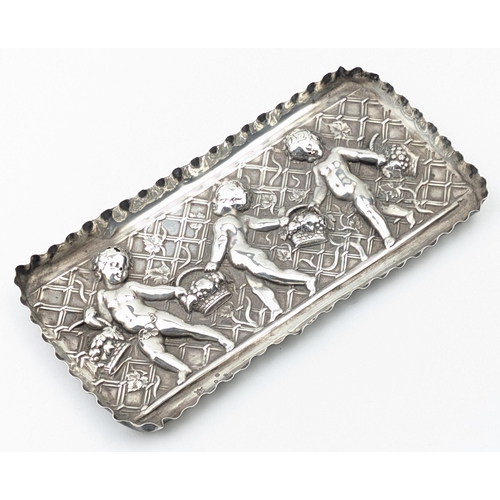 1114 - An antique embossed silver tray decorated with cherubs with baskets, marked for London 1891 by Samue... 