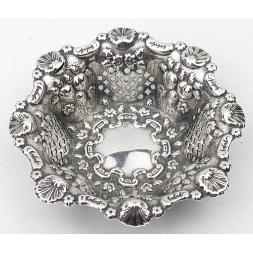 1115 - A good quality embossed silver bonbon basket with pierced decoration, marked for London 1897 by Matt... 