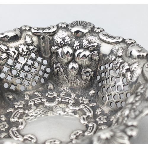 1115 - A good quality embossed silver bonbon basket with pierced decoration, marked for London 1897 by Matt... 