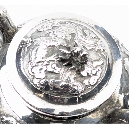 1123 - An impressive Chinese export silver sugar bowl with lid, embossed dragon design with a dragon head f... 