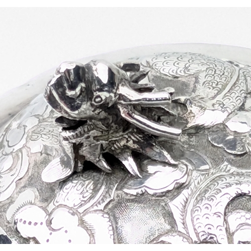 1123 - An impressive Chinese export silver sugar bowl with lid, embossed dragon design with a dragon head f... 