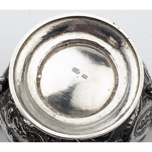 1123 - An impressive Chinese export silver sugar bowl with lid, embossed dragon design with a dragon head f... 