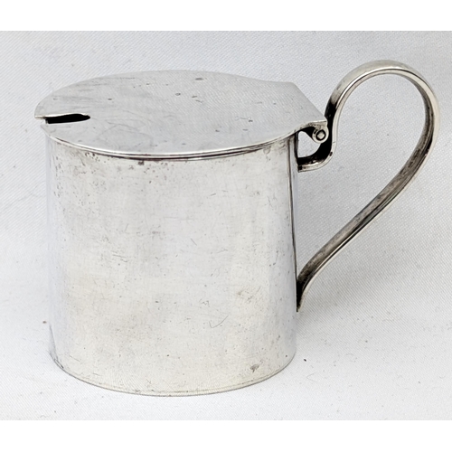 1127 - An antique silver mustard pot, Birmingham 1944 by J E Bushell, approx 45mm tall, approx 58.15g gross... 