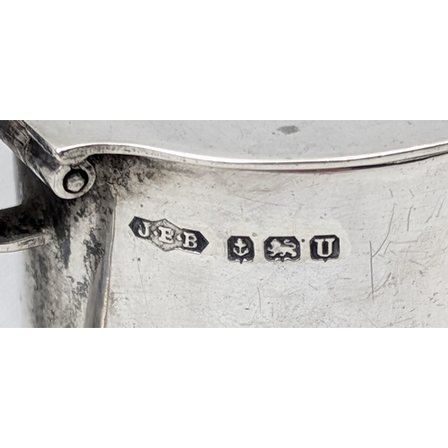 1127 - An antique silver mustard pot, Birmingham 1944 by J E Bushell, approx 45mm tall, approx 58.15g gross... 