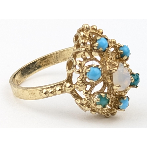 1150 - A retro 14ct gold ring set with turquoise and moonstone, indistinctly marked to reverse but XRF conf... 