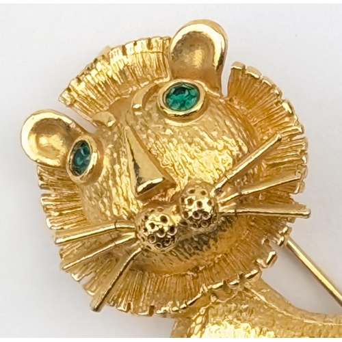 1163 - A retro gold plated brooch formed as a cartoon lion with facet cut jewelled eyes, indistinctly marke... 