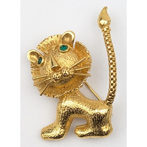 1163 - A retro gold plated brooch formed as a cartoon lion with facet cut jewelled eyes, indistinctly marke... 