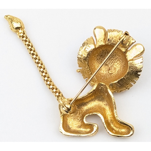 1163 - A retro gold plated brooch formed as a cartoon lion with facet cut jewelled eyes, indistinctly marke... 