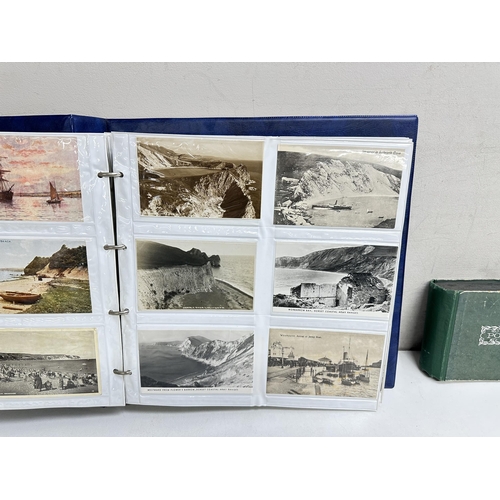 545 - 2 postcard albums and contents, mainly British seaside and Northern European scenes