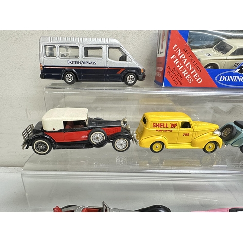 623 - A qty of toy vehicles to include a boxed MRC Elvis pink Cadillac and a qty of other unboxed vehicles... 