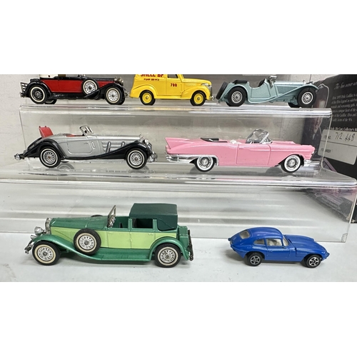 623 - A qty of toy vehicles to include a boxed MRC Elvis pink Cadillac and a qty of other unboxed vehicles... 