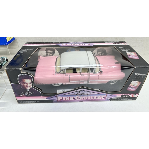 623 - A qty of toy vehicles to include a boxed MRC Elvis pink Cadillac and a qty of other unboxed vehicles... 