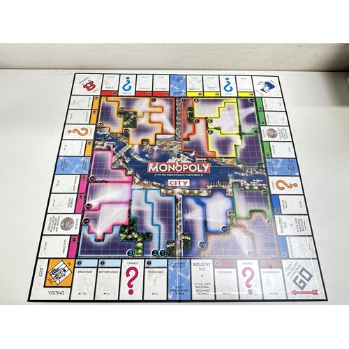 636 - 5 Various Monopoly games to include Monopoly City, U-Build Monopoly, Crazy Cash, Monopoly city and Z... 