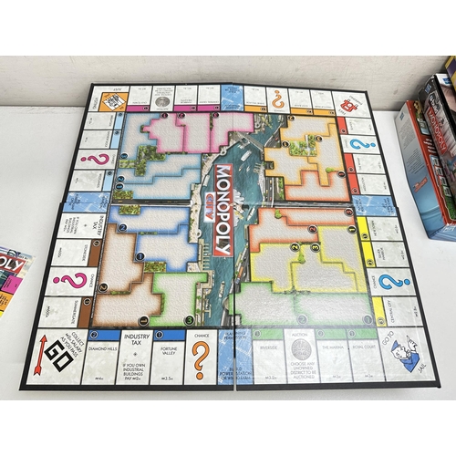 636 - 5 Various Monopoly games to include Monopoly City, U-Build Monopoly, Crazy Cash, Monopoly city and Z... 