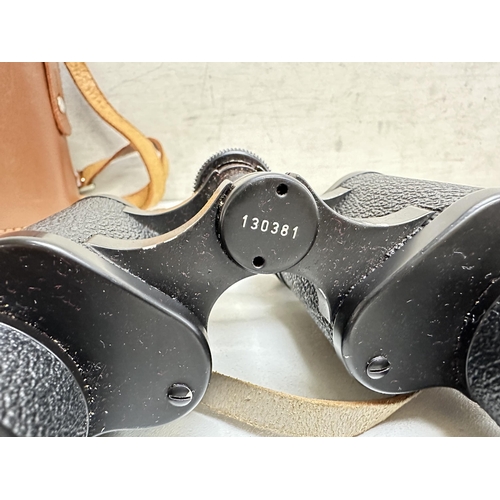 729 - A pair of Hartmann Wetzlar 117 Porlerim 9x40 binoculars in original leather case