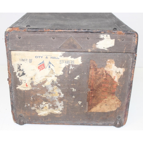 1683 - 2 vintage trunks, one metal and one canvas with labels and 2 wicker baskets, the metal trunk approx ... 