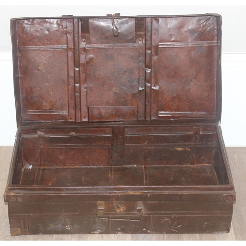 1683 - 2 vintage trunks, one metal and one canvas with labels and 2 wicker baskets, the metal trunk approx ... 