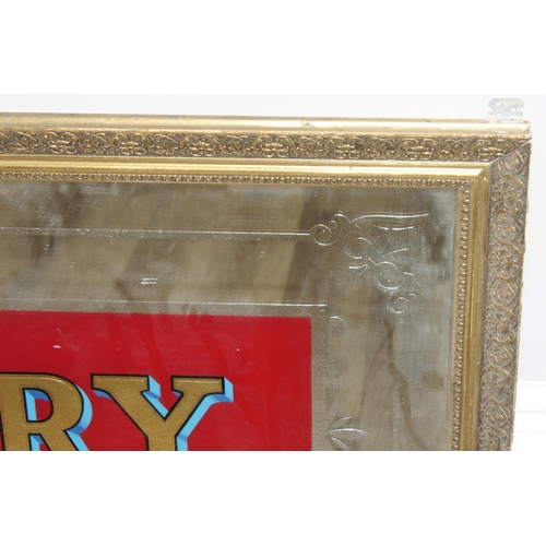 352 - A very large vintage mirror emblazoned with 