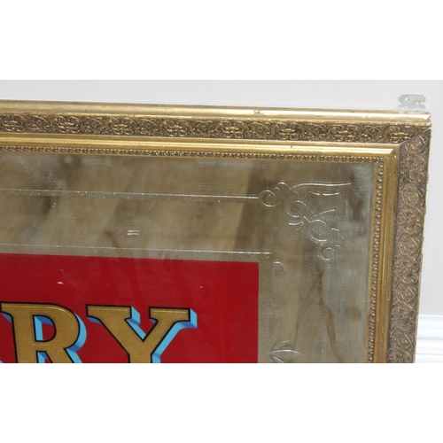 352 - A very large vintage mirror emblazoned with 