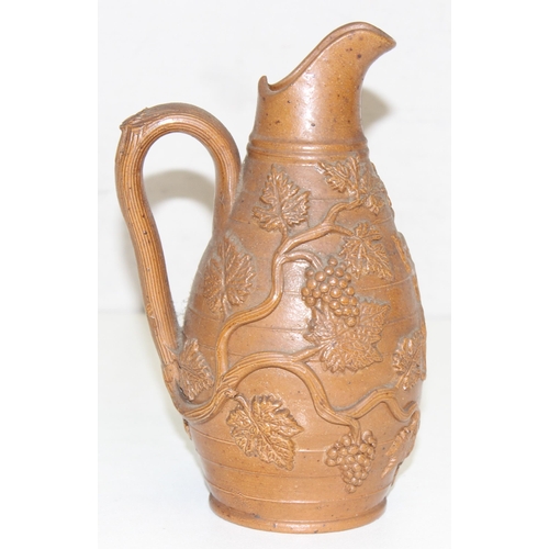 1505 - A superb quality 19th century stoneware jug with bacchanalian vine moulded relief design, believed t... 