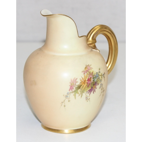 1507 - A Royal Worcester blush ivory jug or ewer decorated with flowers, marked for 1909 (17 dots) round th... 