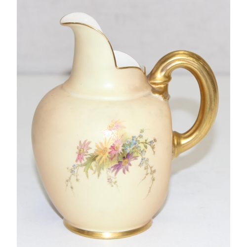 1507 - A Royal Worcester blush ivory jug or ewer decorated with flowers, marked for 1909 (17 dots) round th... 