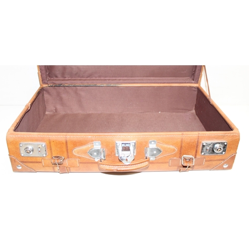 299C - A vintage leather suitcase with chrome plated fittings and various straps, seemingly unbranded, appr... 