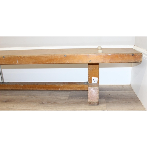 20 - A long vintage low wooden school gymnastics bench, approx 336cm long