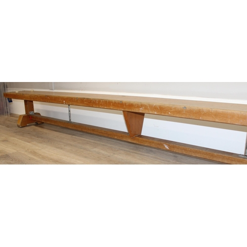 20 - A long vintage low wooden school gymnastics bench, approx 336cm long