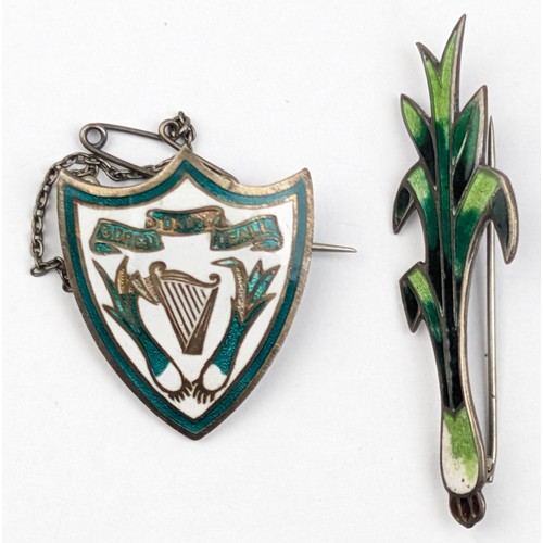 1186 - 2 antique silver and enamel brooches both with Welsh leek related decoration, one marked Sterling, t... 