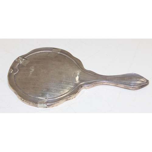 1135 - A vintage silver hand mirror, marked for Birmingham 1910 and confirmed as 925 silver, approx 29cm ta... 