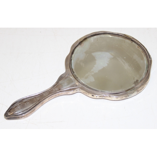 1135 - A vintage silver hand mirror, marked for Birmingham 1910 and confirmed as 925 silver, approx 29cm ta... 