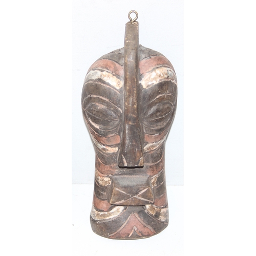 1530 - 5 assorted African masks with painted details, possibly Senegalese, the largest approx 44cm tall