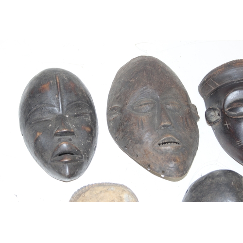 1531 - A group of 5 assorted African carved wooden masks, unknown age or origin, the largest approx 24cm ta... 