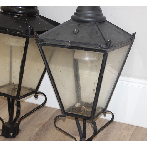 251 - A pair of Victorian style black painted copper street lamp or lantern tops, likely 20th century with... 